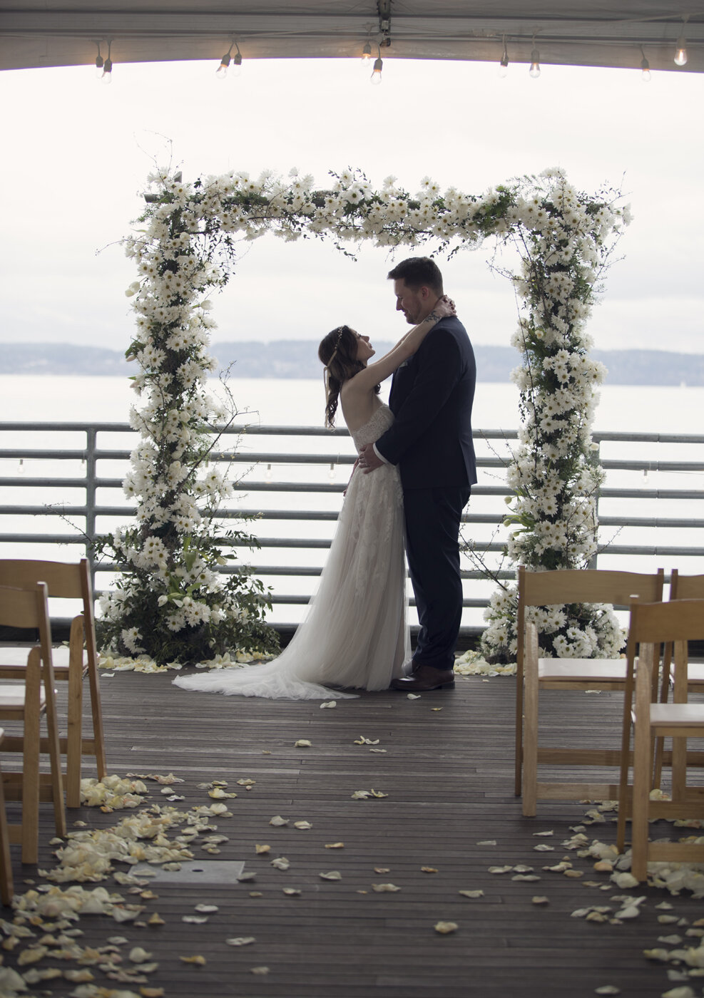 Seattle waterfront wedding in February with daisiy arch by Bond in Bloom, Ray's Boathouse.jpg