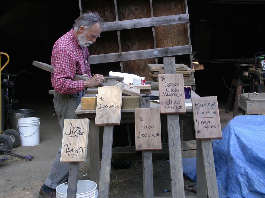 Gerow crafting signs for the Jikoji grounds.