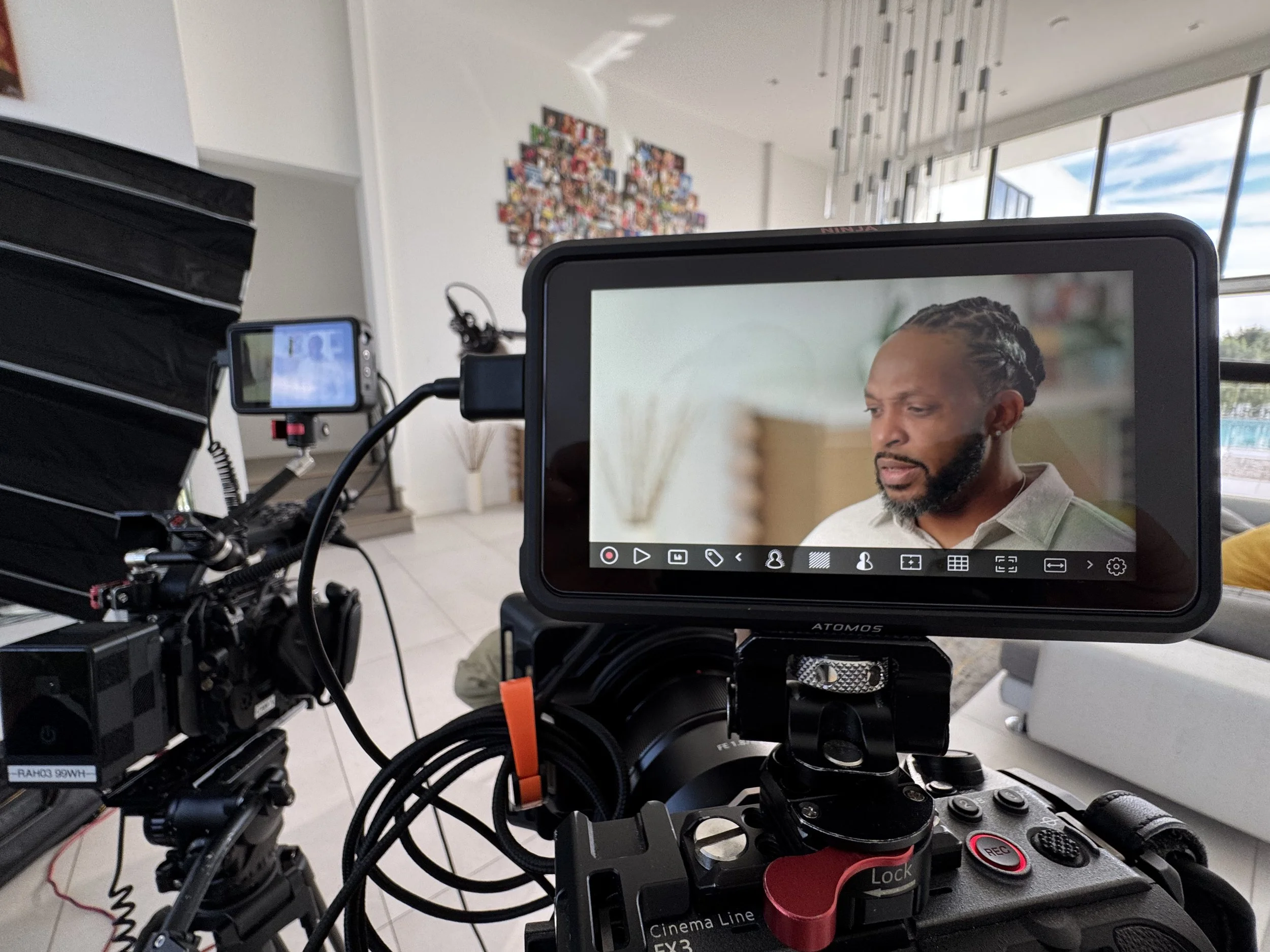 Documentary interview subject framed on a professional camera monitor in Miami