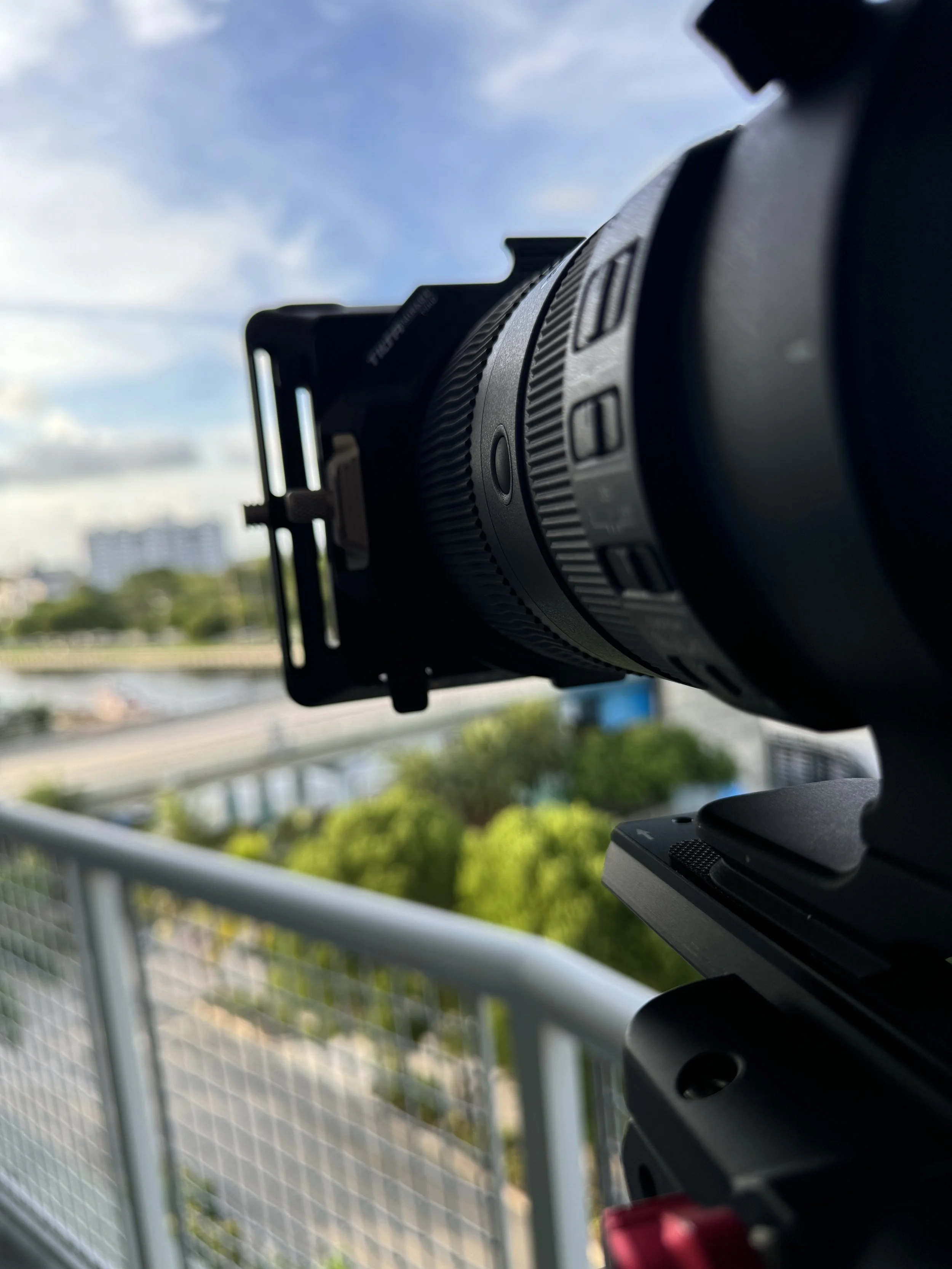 Professional video camera positioned to capture a hospital helicopter landing in Miami
