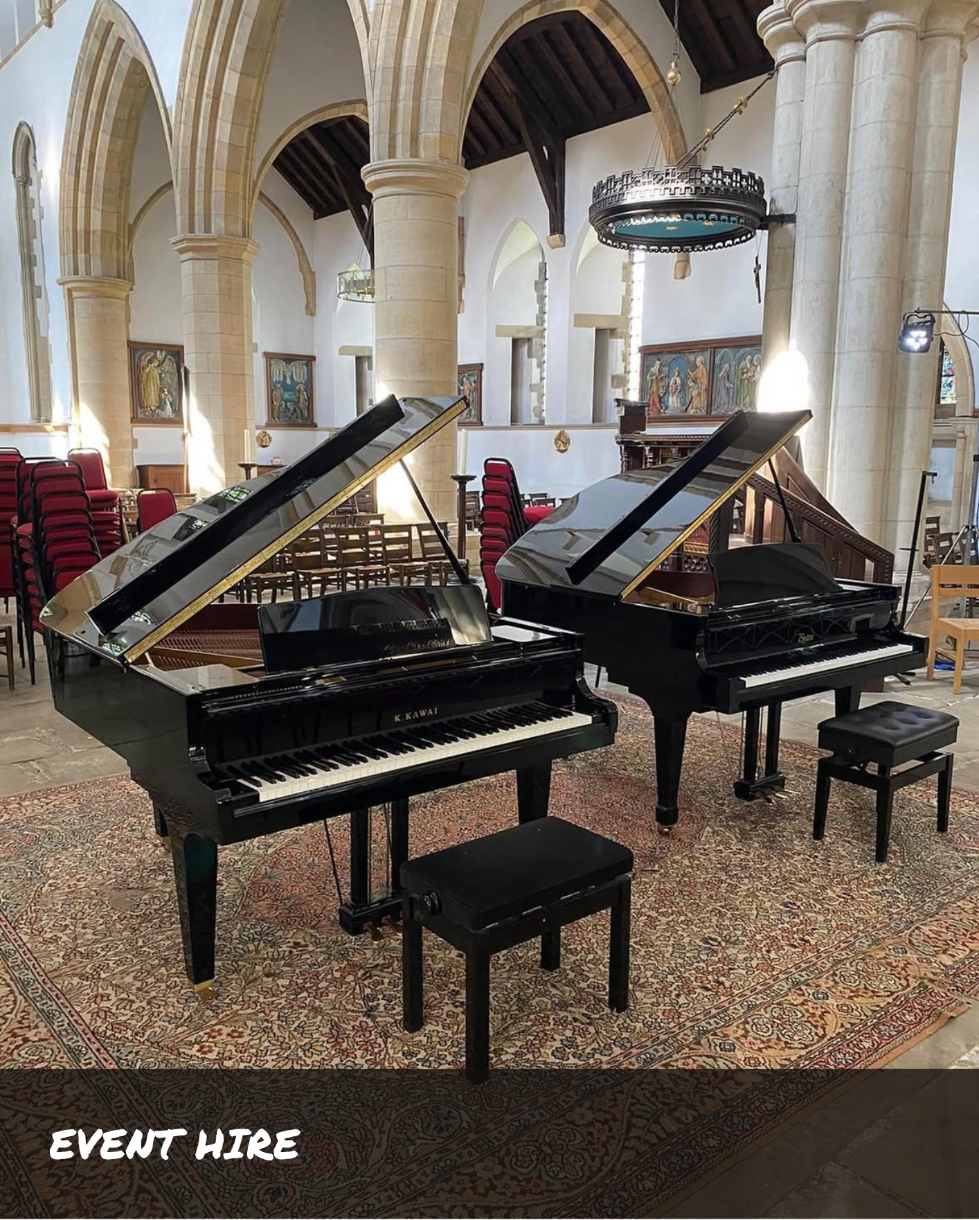 Picture of two grand pianos set up in a church