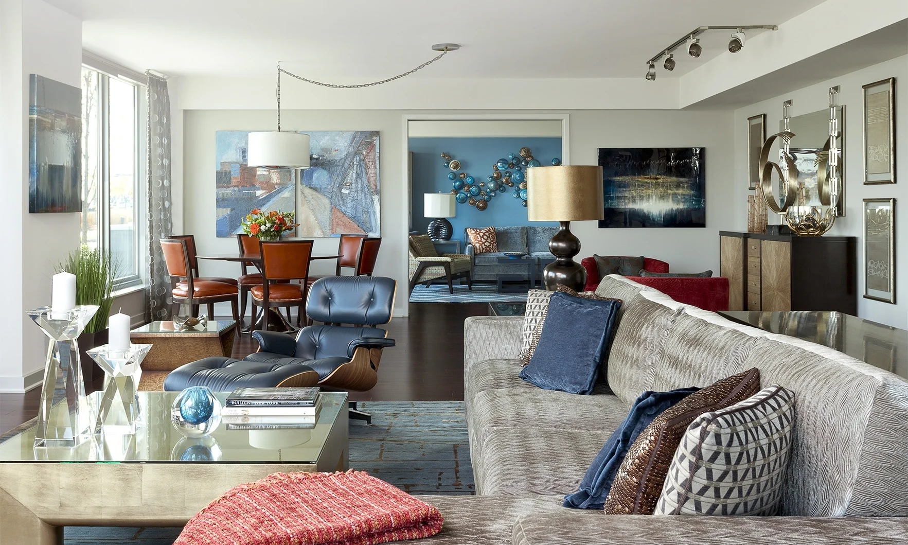  This sophisticated residence is a haven of blue. &nbsp;It has a tailored contemporary look while simultaneously utilizing bold colorful patterns. 