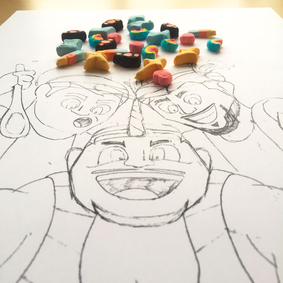 Original sketch had the unicorn tips touching and was told it was a little "too on the nose". Also, I hand sculpted, and painted the marshmallows for the cereal we used on the box art.