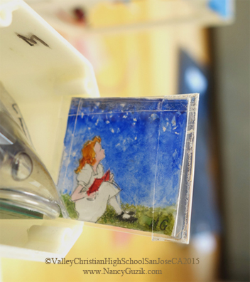 STAR GAZER, Nancy Guzik, Watercolor, 1.25”x1.25” Painting being placed in the young scientist’s experiment; the artwork is protected in glassine envelopes sealed with waterproof tape. (Now in orbit thanks to Valley Christian High School, San Jose, CA, http://www.vcs.net/ )