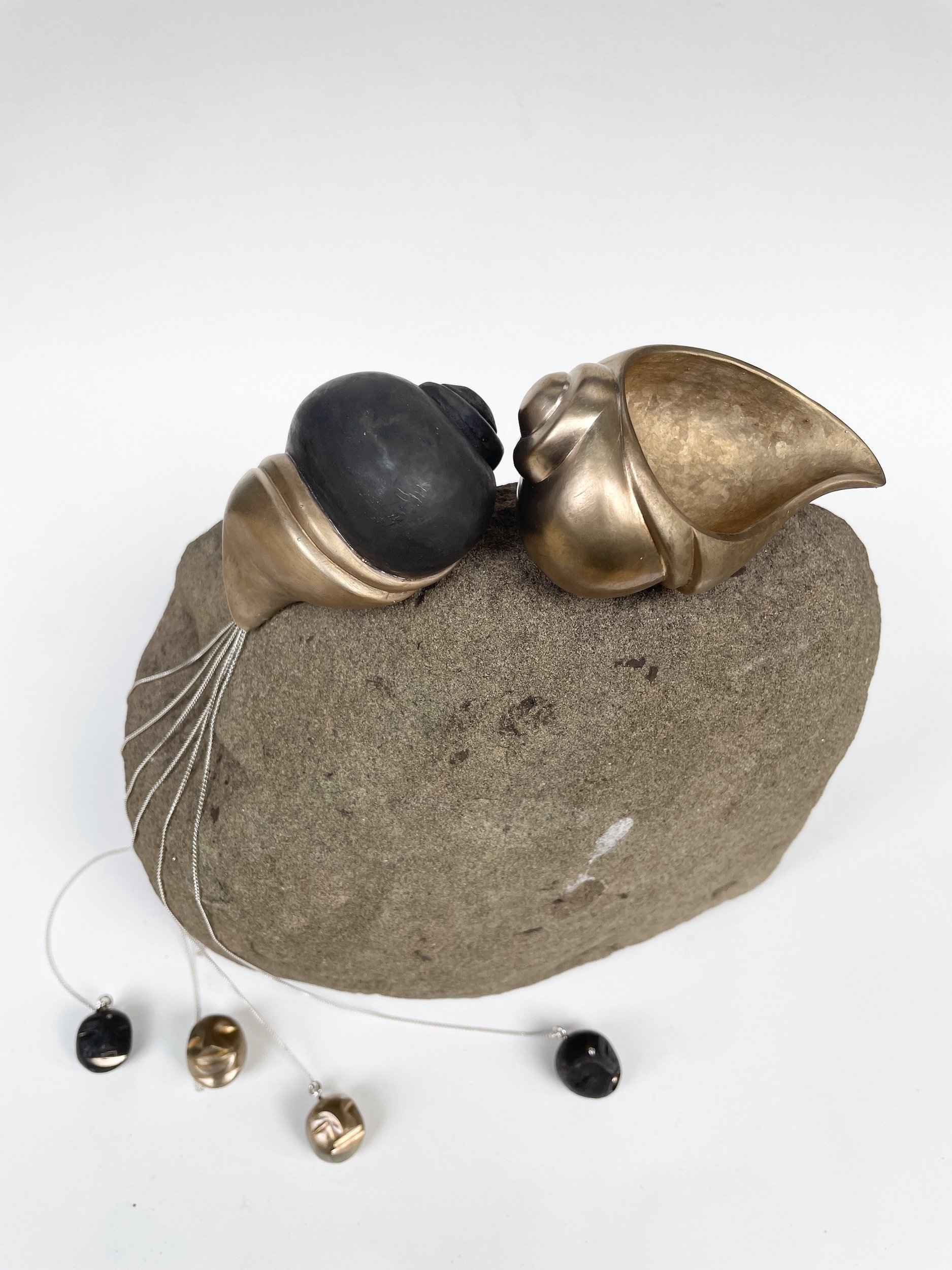 Two Snail Totem On Rock With Cosmic Thread Headz