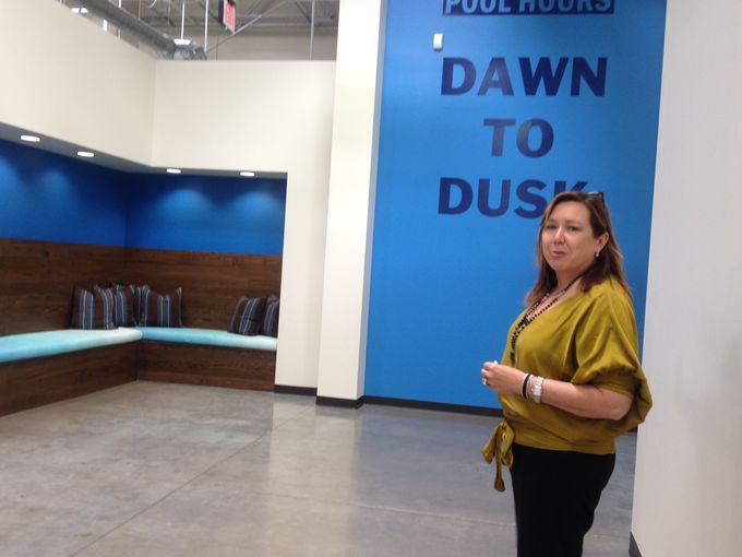 Architect Anne Sneed stands in one of the pool-themed corners in the new Leslie's Swimming Pool Supplies headquarters and customer service center at 20th Street and Indian School Road. (Photo: Laurie Merrill/The Arizona Republic)
