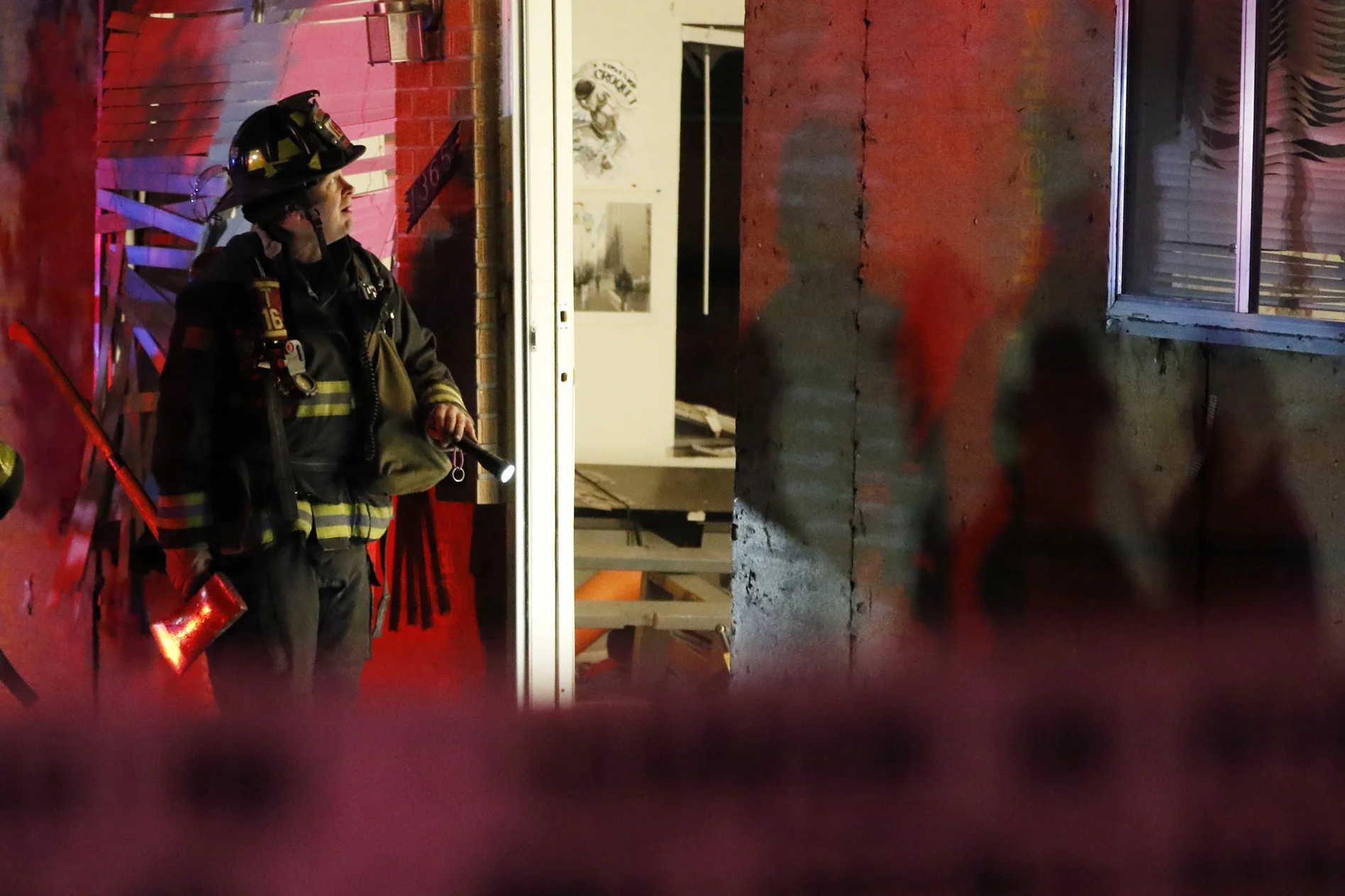 Denver, CO- A Denver fireman examines the damage done inside a South Denver home that was involved in an explosion the evening of Nov 5, 2015. The blast was caused by an in-home weed concentrate operation, one in which heavy amounts of butane are involved.