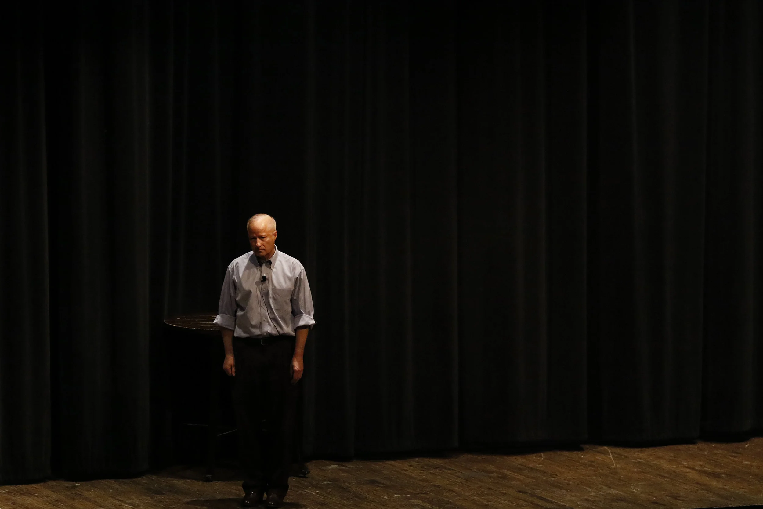 Representative Mike Coffman stands on a lonely stage in the Cherry Creek High School Fine Arts Auditorium fielding questions from constituents of the 6th Congressional District, Feb. 20 during a town hall. The town hall provided constituents the opportunity to pose questions to Coffman relating to issues such as gun control, dreamers and his support for the GOP tax plan.