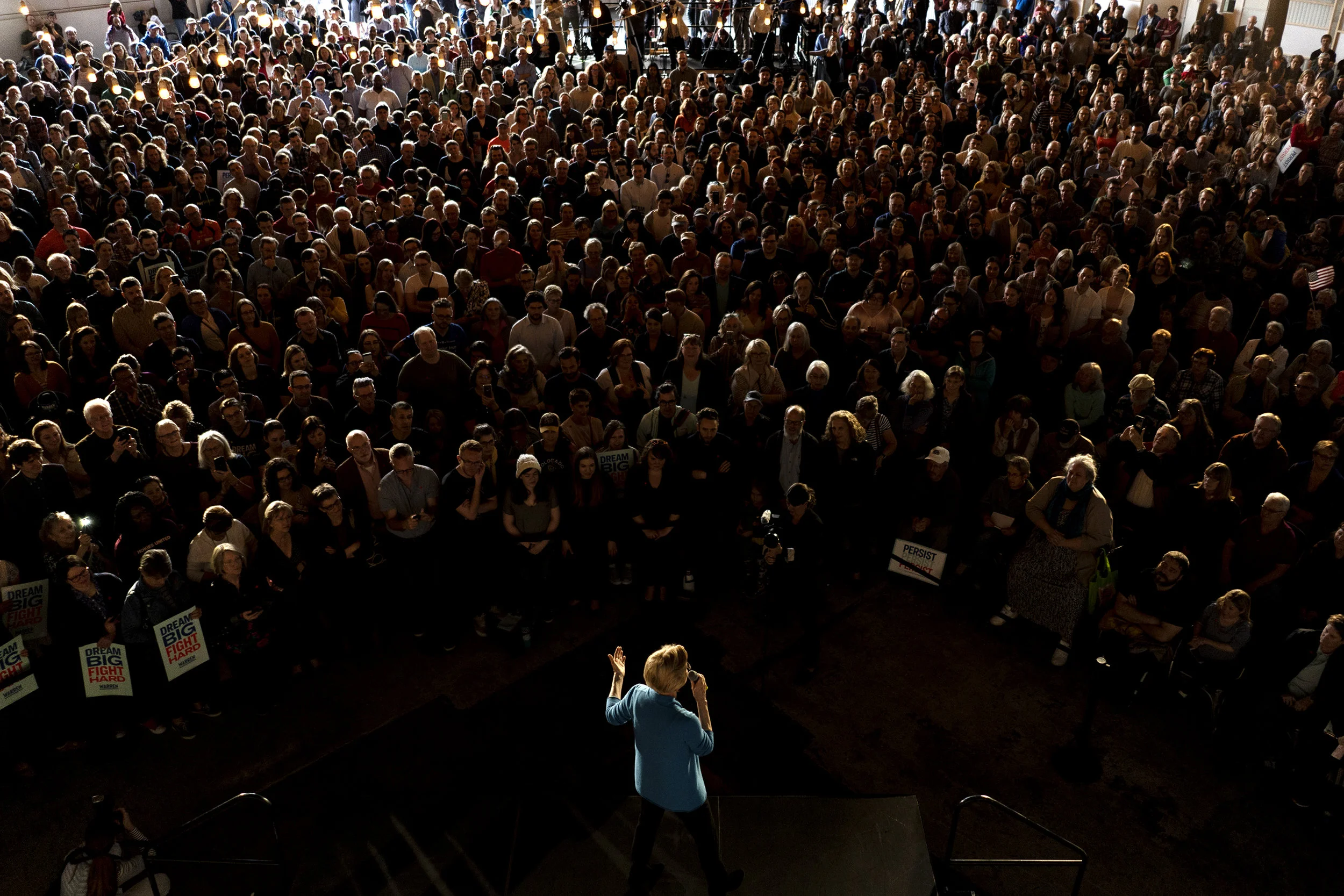 Elizabeth Warren addresses the crowd during an organizing event for her 2020 presidential campaign, April 16, 2019, in the hangar at the Stanley Marketplace in Aurora.