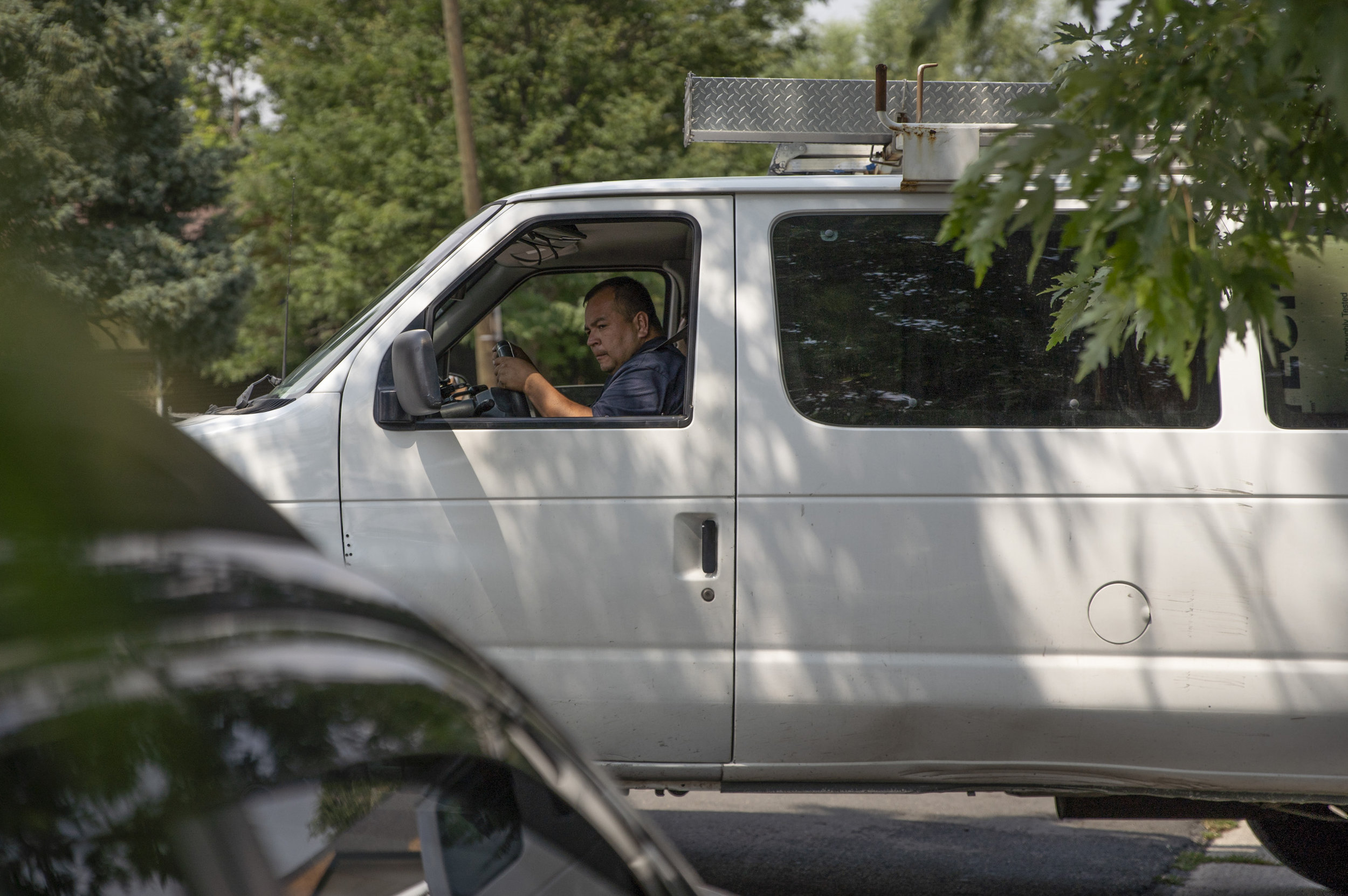 Edgardo has as many as five projects going at any given time. He backs his van into the driveway of a home he is completely remodeling after having to go to clients home to take care of a minor issue.