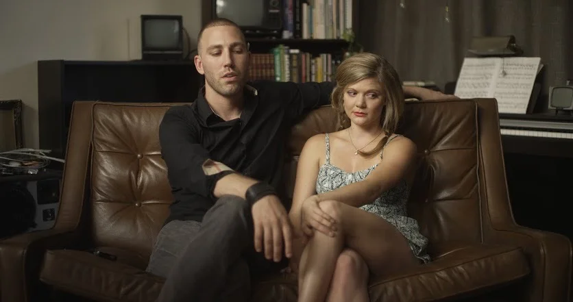 Christopher Powers and Erin Dowling playing Bryan Burton and bored bimbo. 