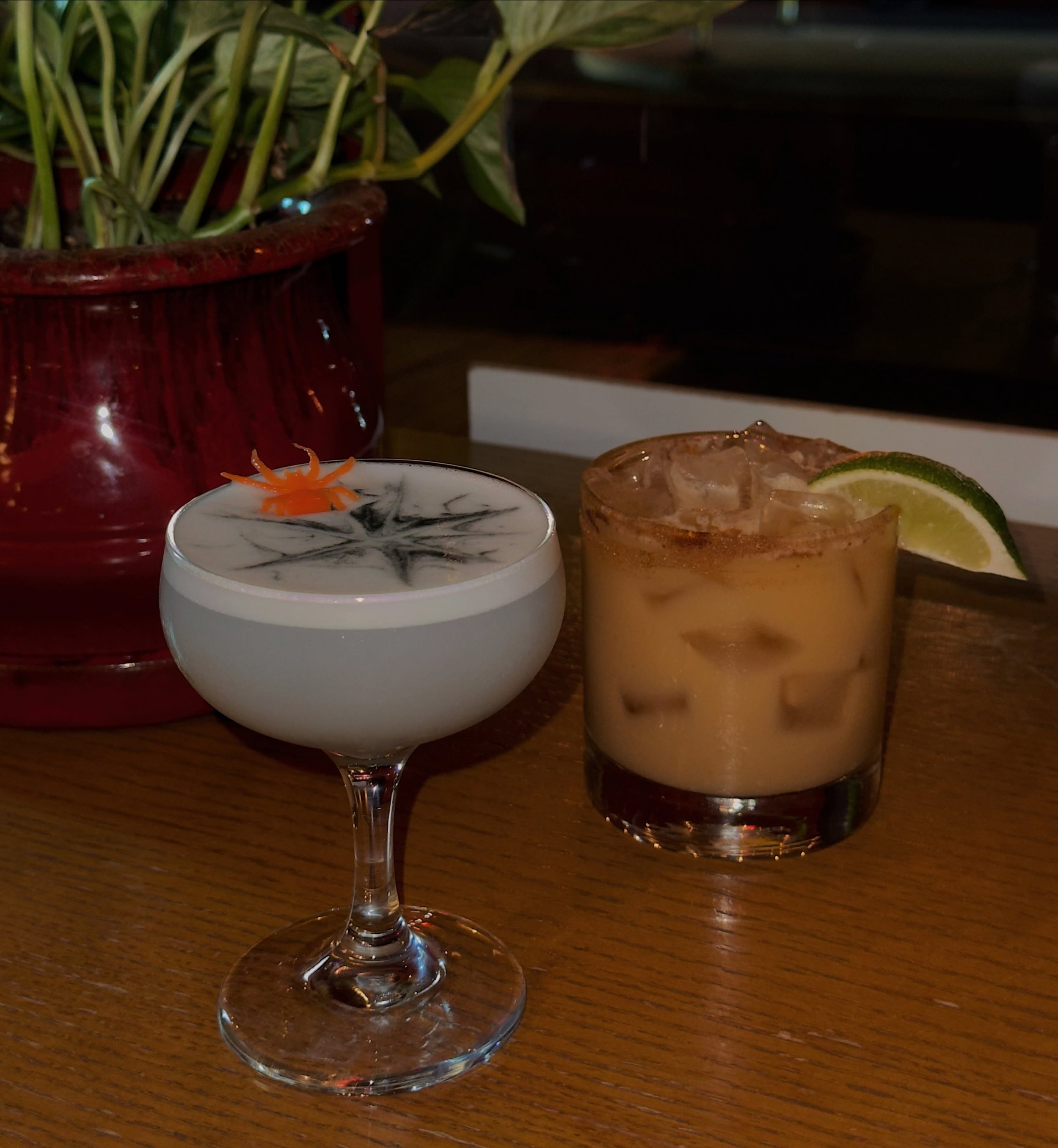 Spooky sips await you at East Glisan!

Foolish Mortals: [pictured left] 🕷️ 
gin, cr&egrave;me de violette, maraschino cherry liqueur, lemon, egg white, charcoal sugar

Caramel Apple Margarita: [pictured right] 🍏 
reposado tequila, spiced apple cide