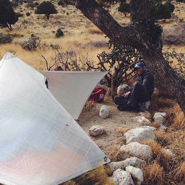 Ken watching Thomas set up his tarp at our car camping spot