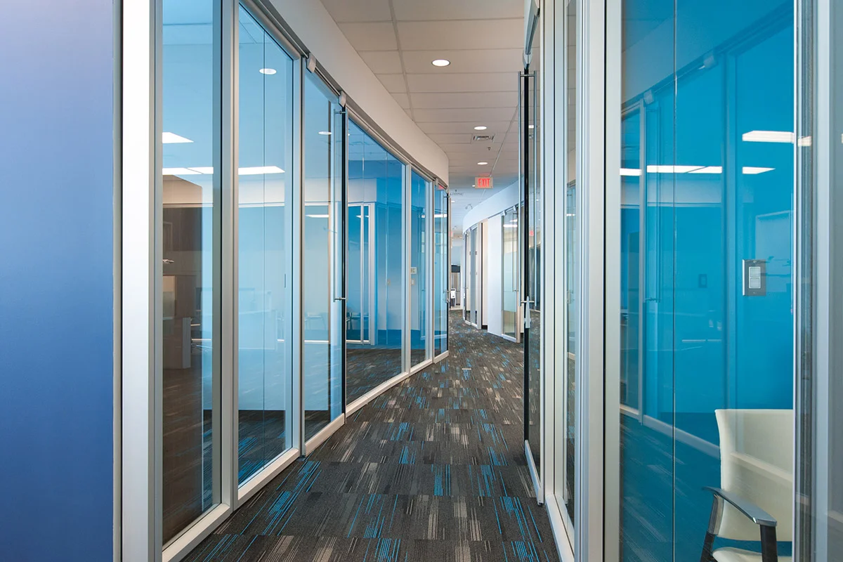 Air Partners YYC International Airport, Calgary 2013 Soft curves and thin planes reference flight in this private air terminal near the International Airport. Faceted Teknion walls create a unique curved corridor experience as users pass through the space.