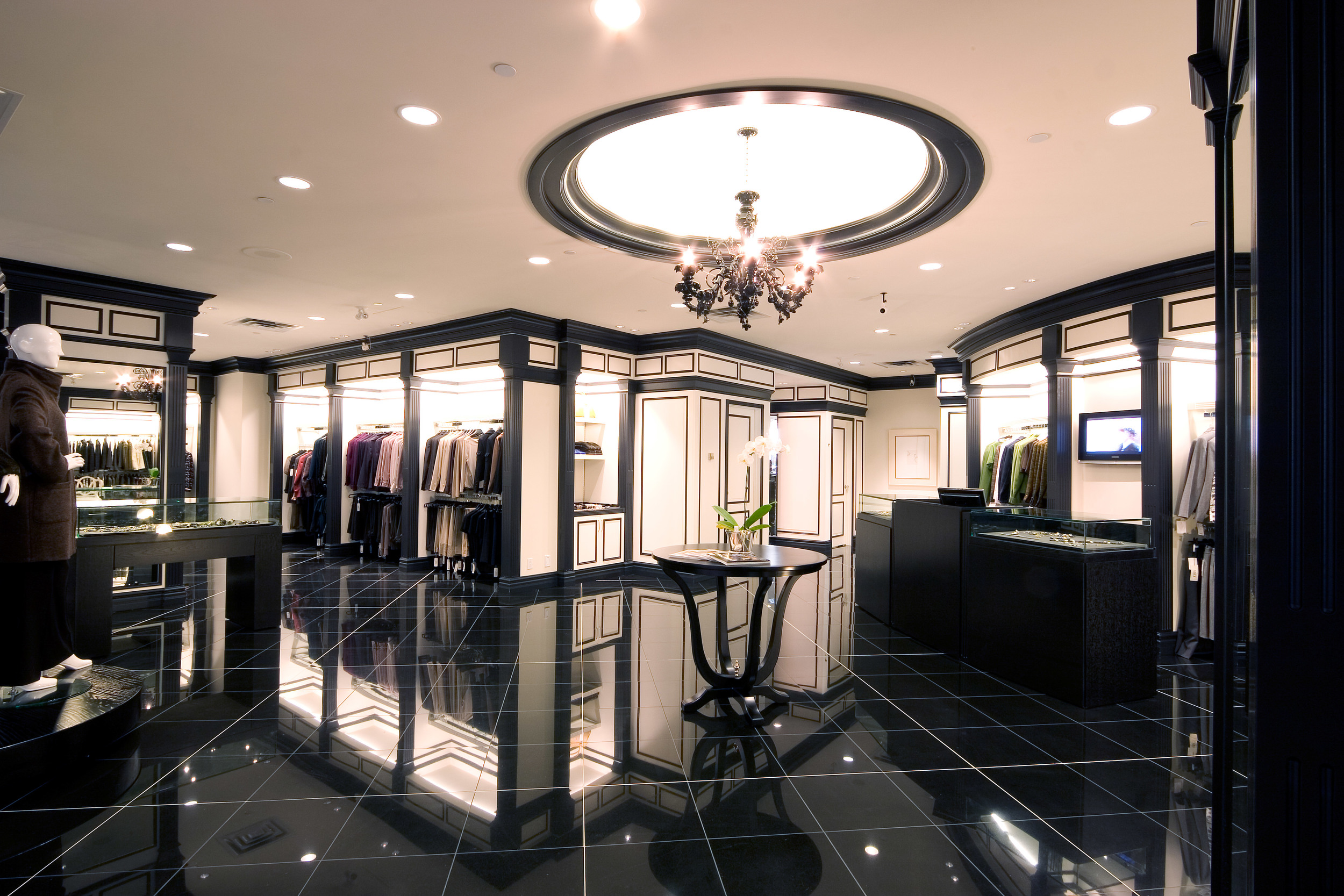   La Chic&nbsp; Bankers Hall, Calgary&nbsp;  A high-end boutique retail interior with a high-contrast color and lighting scheme designed to specifically enhance the look of the products for sale. Traditional detailing combined with modern finishes. 