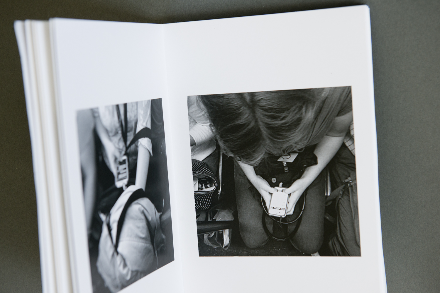 Inside there are nicely printed photographs of subway riders. The scale of the images, with plenty of white space around them, gives them room to breathe within the confines of the small book. The prominent text on the cover alludes to the poetry that Ackman has incorporated alongside the images.