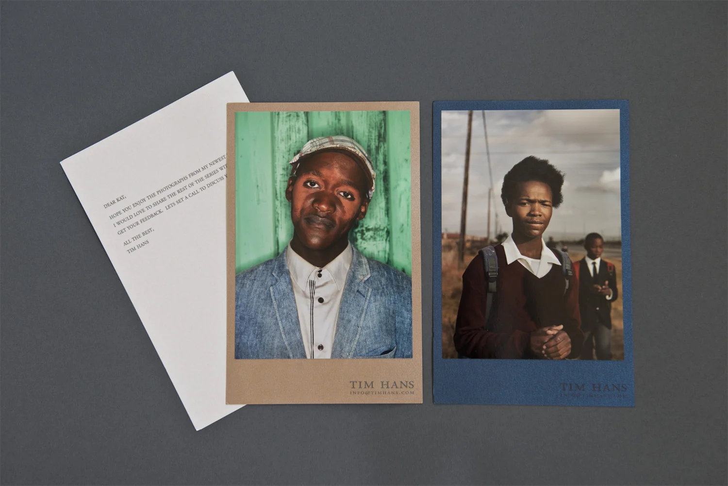 Sometimes photographers send submission packets that contain virtually no information about who they are and what intentions they have for their work. Other times we receive novellas of the artist’s life story and aspirations. Tim Hans’ portfolio sample was just the right balance. He included a letter of introduction that was short, to the point, and not presumptuous, while still making it clear that he wished to discuss the work further. The two images included are on metallic paper to provide a sense of what the exhibition print quality might be. The shiny colored papers they are mounted on are an unusual choice, but coordinate well with the prints and contain his contact information. By mounting the prints onto these cards, Hans creates a professional presentation with a handmade feel.