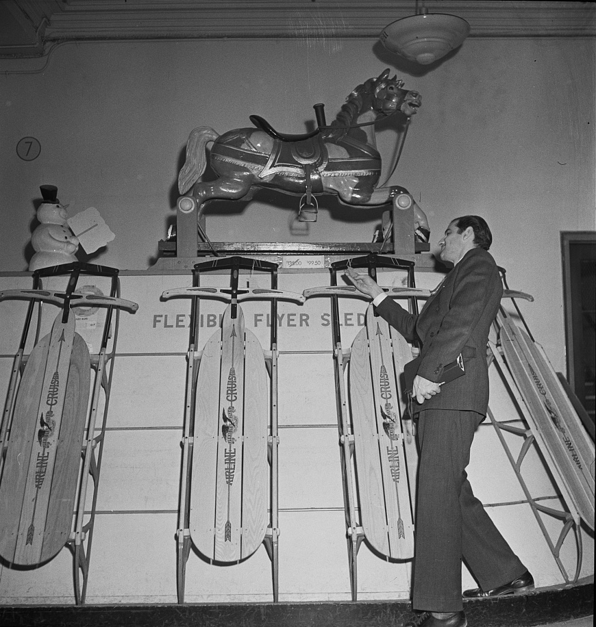 Toy department display at R.H. Macy and Company department store during the week before Christmas 1942. The hobby horse above costs almost one hundred dollars. Photo by Marjory Collins.