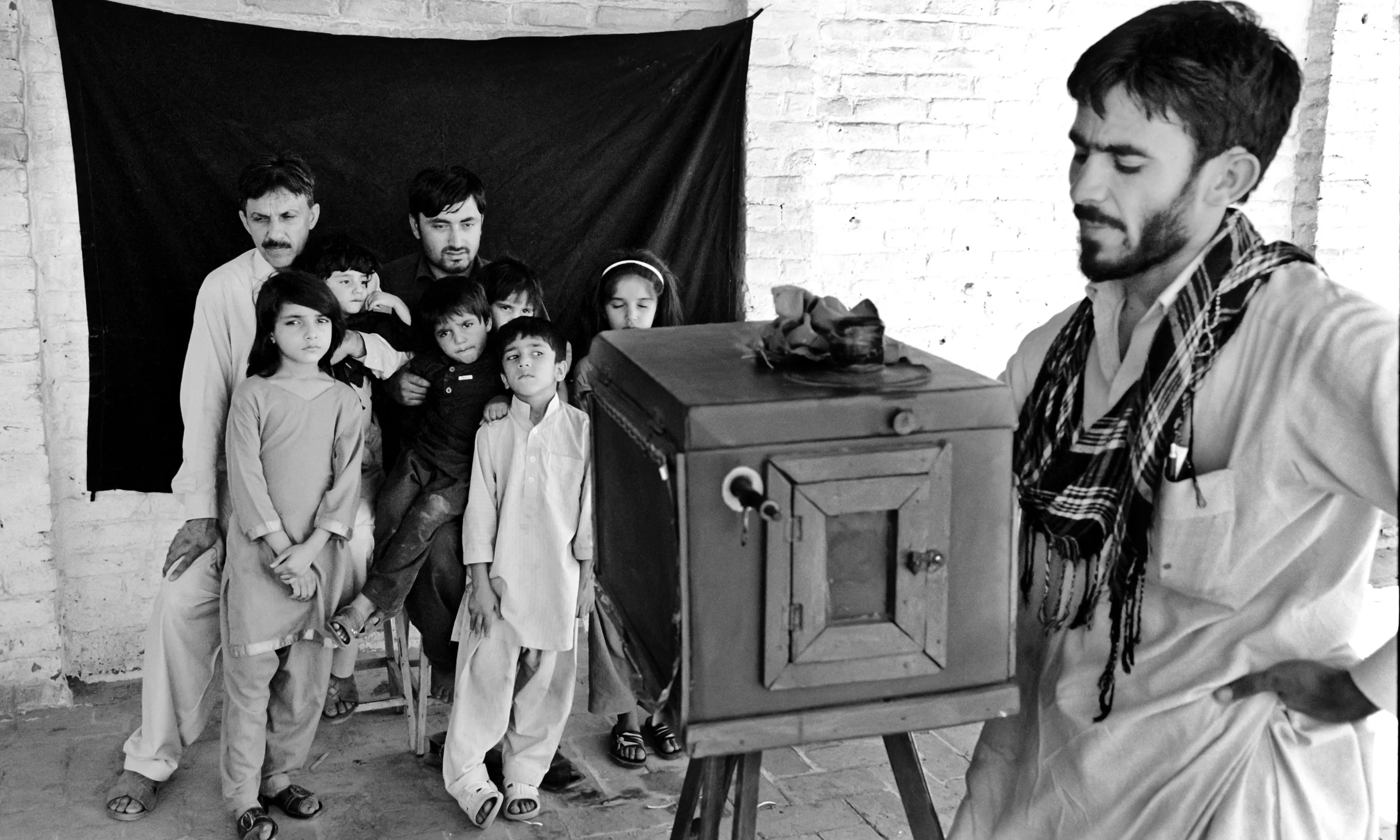 Izzat Ullah making a family photograph, Peshawar, 2012.
