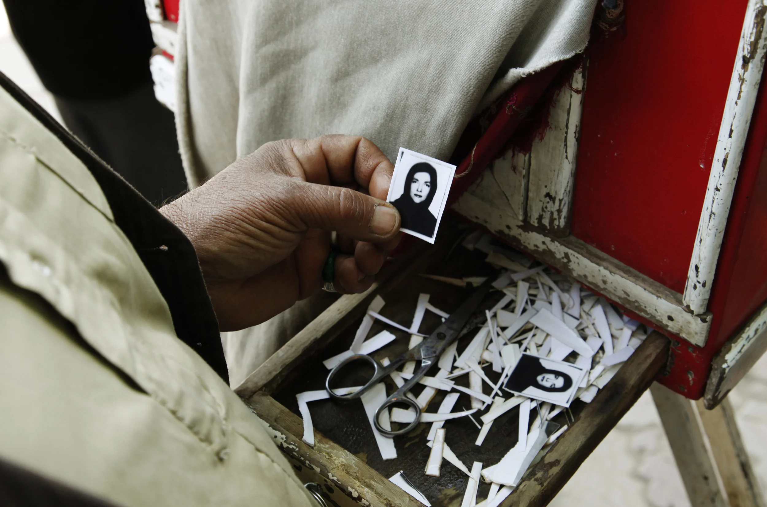 Roh Ullah holding a copied photograph he made with his Box Camera. The original was a color digital portrait. Kabul, 2011.