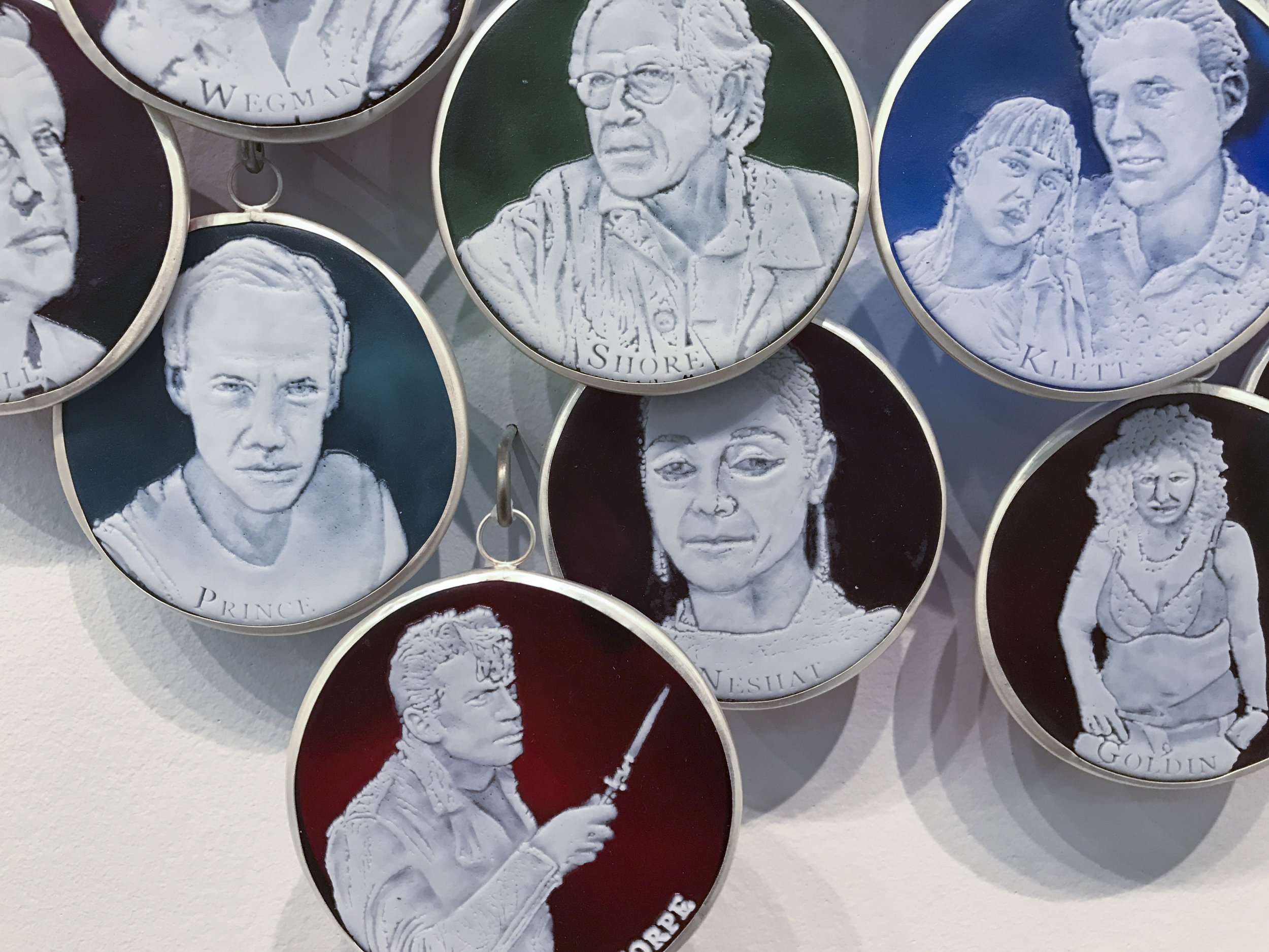 Capturing Light: A History of Photographers (detail), Charlotte Potter, 2017, Hand engraved glass, silver, tin, stainless steel, 3 x 3 inches each cameo, 13 feet long installation.