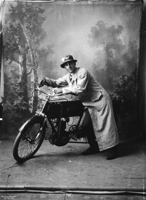 A motorcyclist with his bike, Queensland, Australia, c. 1935