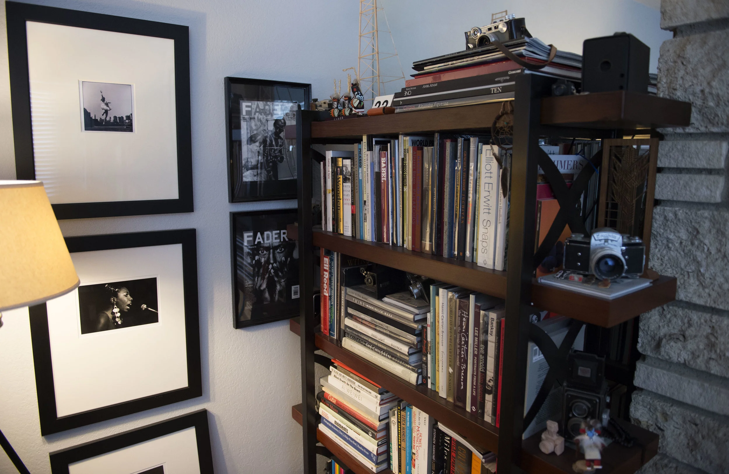 Rex Atienza ’s photobook library surrounded by his favorite prints.
