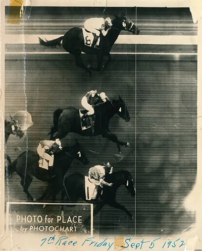The horse at the top "wins by a nose" (across the white vertical line) in a photo finish race during the 1952 State Fair. (Oregon State Archives, Oregon Fair Exposition Center)