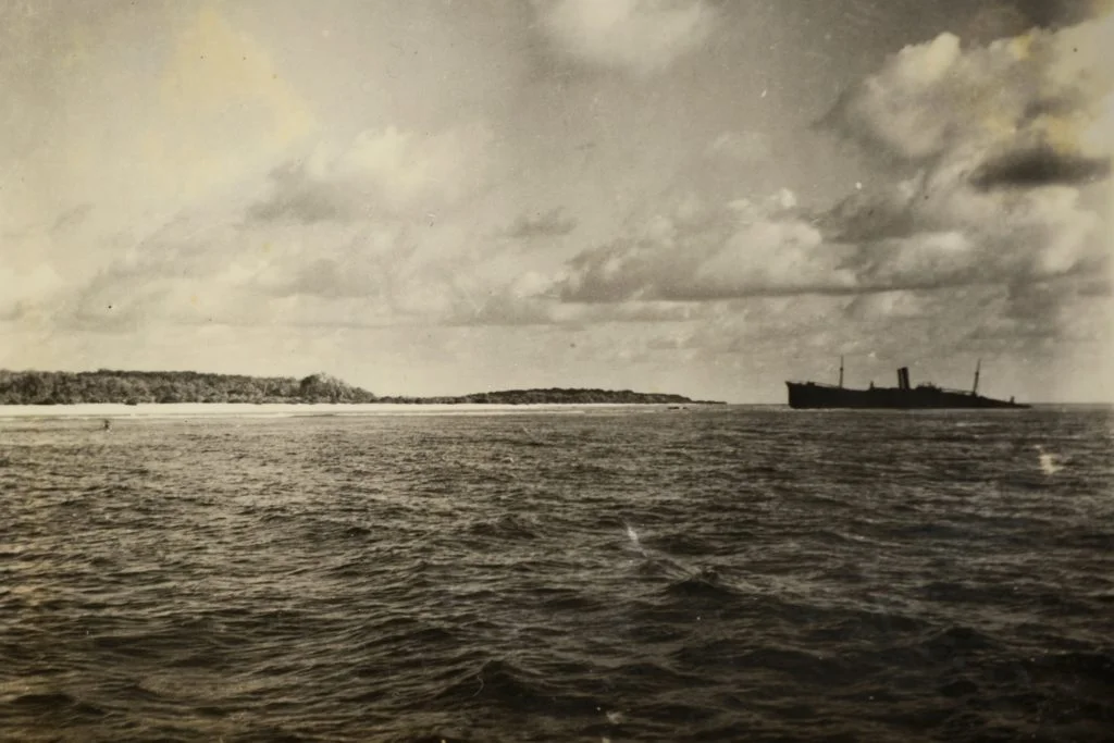 Eric Bevington took this photo of Nikumaroro Island in October 1937. “The Bevington Object” poking out from beneath the waves at the edge of the photo may be the landing gear of Earhart’s plane, a Lockheed model 10-E Electra.