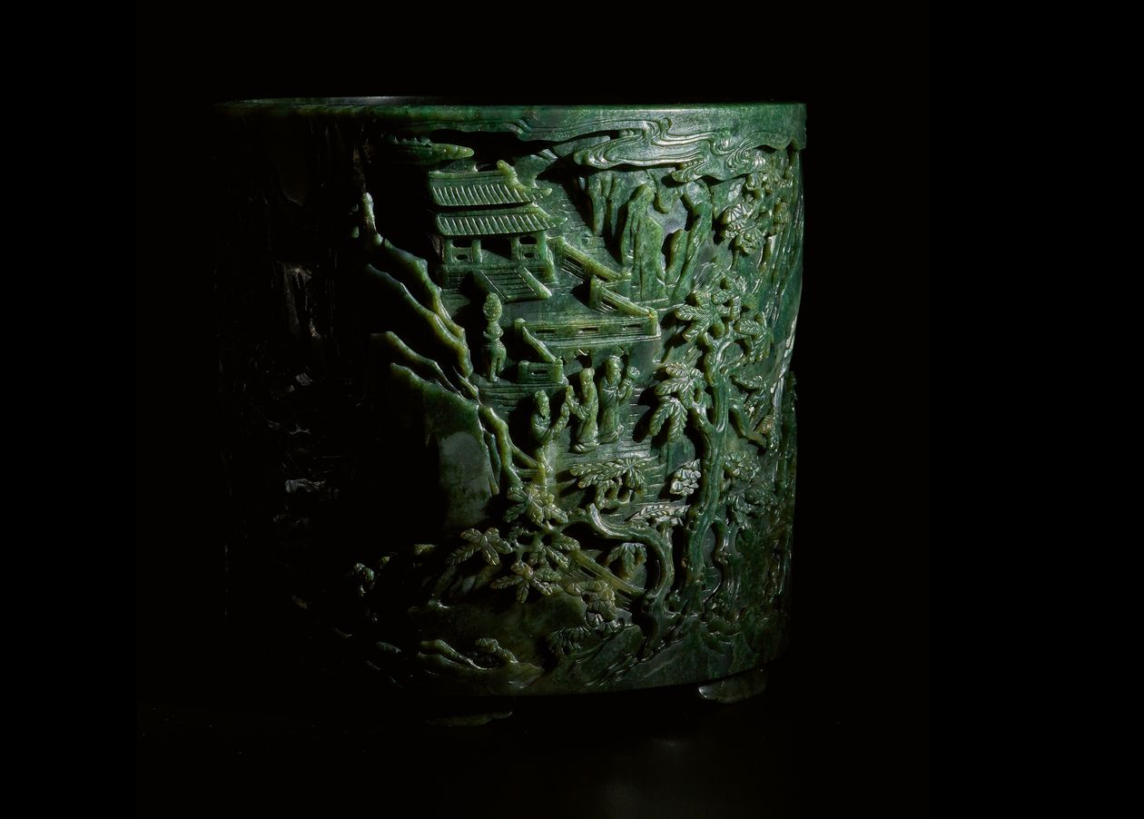 A finely carved large spinach-Ggeen jade 'immortals' brush pot from Qianlong period will lead Sotheby's Asia Week sale in September. Courtesy of Sotheby's