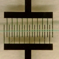 Water colored with blue dye passed over the nickel microelectrodes in a completed device