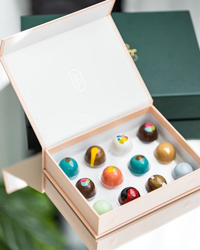 We almost printed a color inside these custom boxes I designed for @poppyandpeepchocolate but I&rsquo;m so glad we left it white so these amazing bon bons can truly SHINE! Each one is truly a work of art
