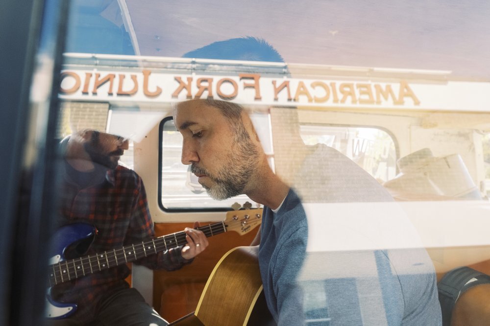 Rick Sannar plays his original song with the band, Mid-Life Crisis, in front of American Fork Jr High on Saturday, Oct. 26, 2019, in Am  Fork, Utah. (Michael Schnell/The Daily Herald via AP)