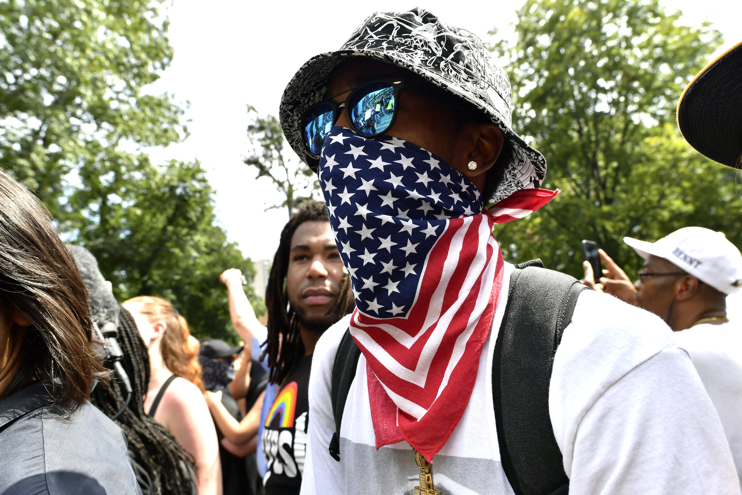  BOSTON, MA Saturday, August 19, 2017 -- Black Lives Matter protesters burn a Confederate flag as tens of thousands of demonstrators turned out to protest the Boston Free Speech Rally on Boston Common. 