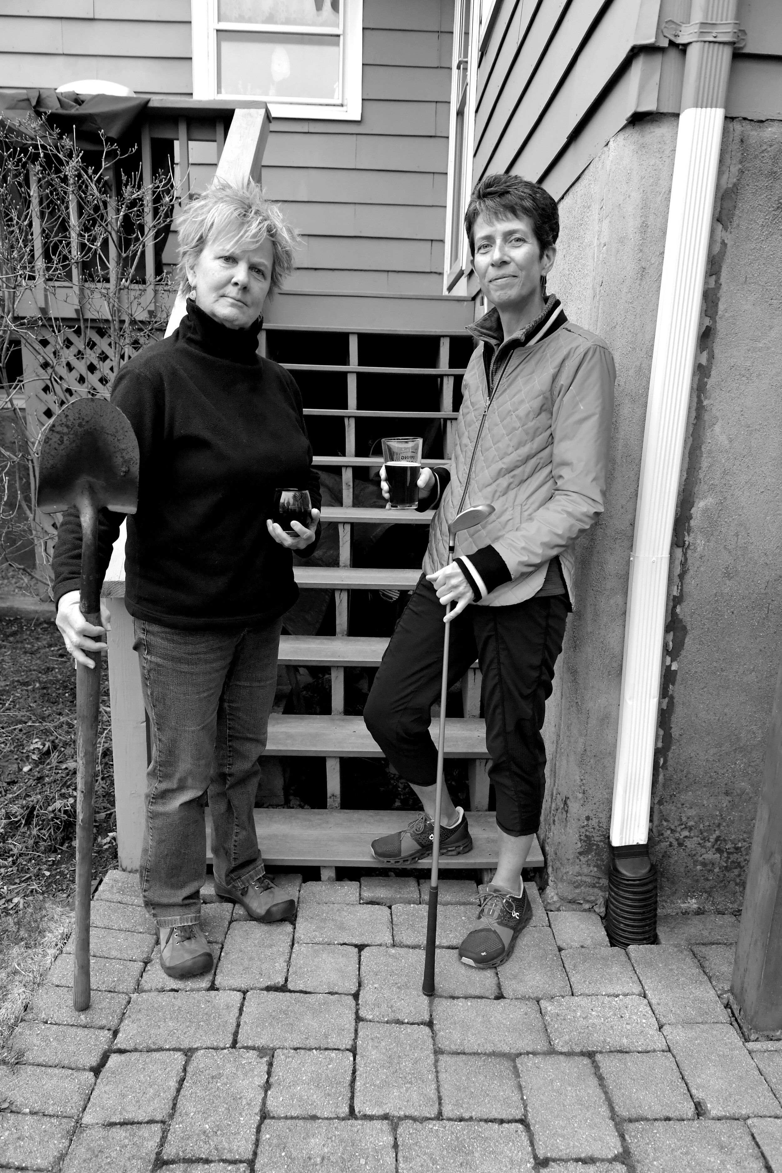  Joanne and Wendy   Joanne is  self-employed in landscape maintenance and design and Wendy is a minister. Tho they are each holding their favorite tools, they share a common love of gardening and golfing, and can often be seen loading their golf club