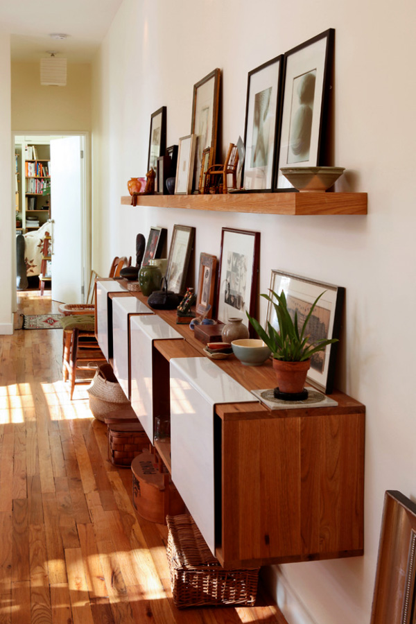 Remember you aren't limited to the traditional nail in wall. Try simply leaning frames or art against the wall, shelves, cabinets, or even the floor