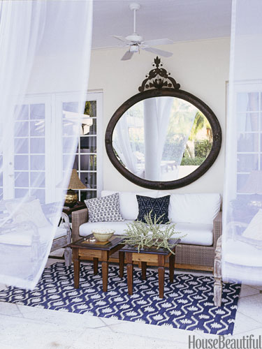 Bring in a mirror to an outdoor space to reflect greenery in any seating area!