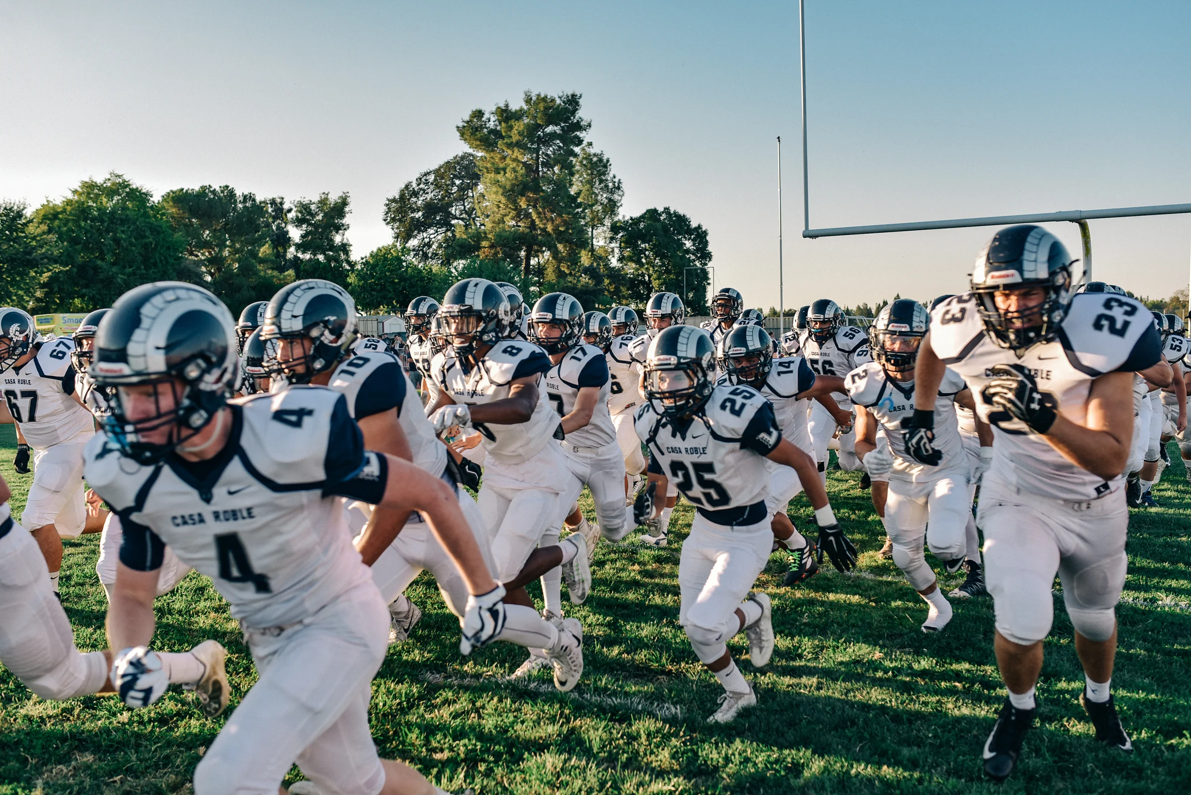 I’m so excited to have football back! Along with photography, fitness has been another huge part of my life. This year I was asked to help with strength training for my son's varsity football team. I grew up in the gym starting at age 13, picking up weights for a membership and am still there several times a week. So, I was very happy to help the team and share some of my experience. It's funny, because when I was in high school and training for football, we used medicine balls, climbing ropes, and pushed my friend's truck in a parking lot. Fast forward to today and we are using the same stuff, except we switched the truck for a sled.
.
.
Anyway, I was very pleased to see the boys come out on Friday's game and dominate physically! I hope it keeps up. The big test will be in the next few games.
Final score from Friday was Casa Roble 56 - Bella Vista 0.
.
.
.
.
.
#Fridaynightlights #football #gidiron #sports #Kids #athletics #sacramento #highschool #trainhard