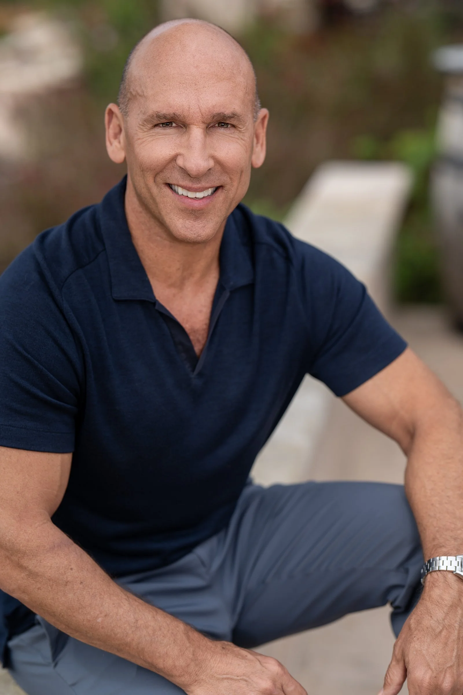 Men's business casual corporate headshot in navy polo, outdoor on-location portrait, Sacramento CA