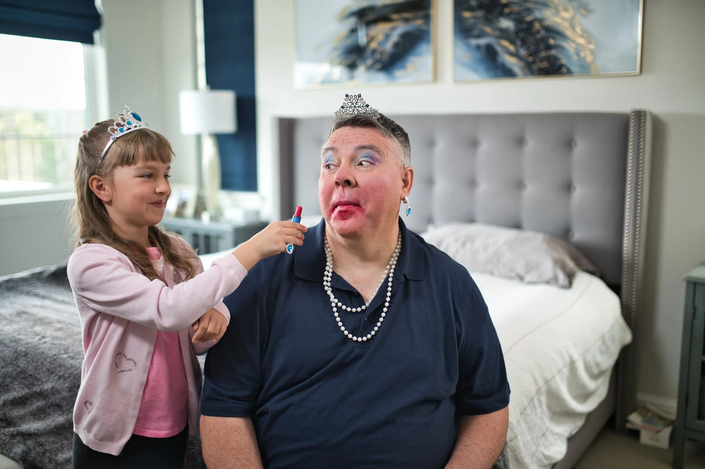 Father playing dress up with young daughter, lifestyle and family brand photography Sacramento
