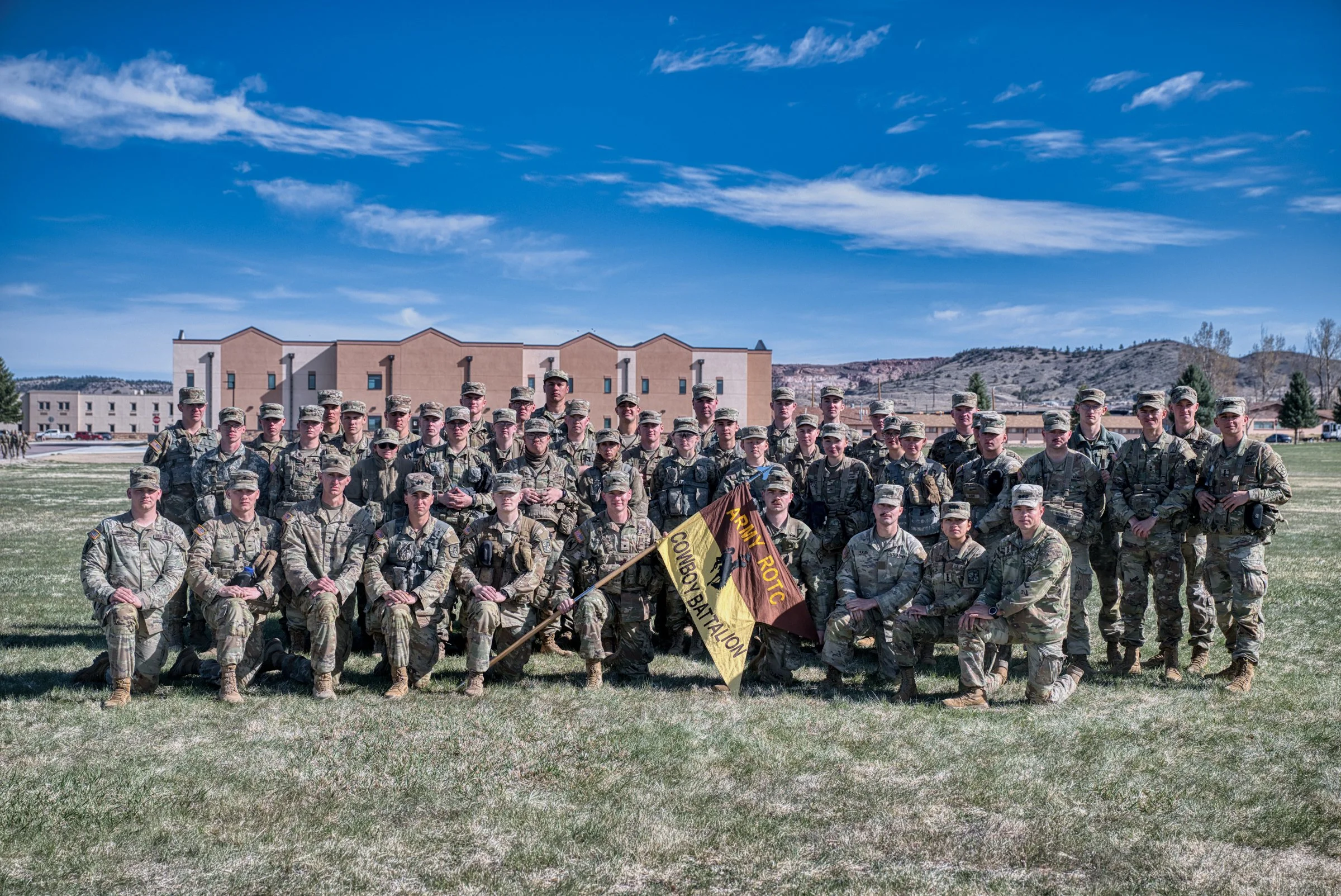 University of Wyoming Army ROTC Cowboy Battalion group photo with battalion colors at Camp Guernsey April 2025 Next one when ready.
