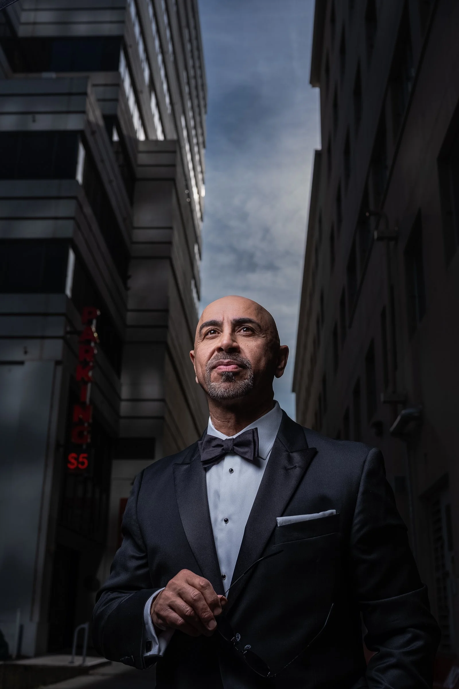 Editorial-style portrait of Sam Altawil photographed in downtown Sacramento using natural reflections and off-camera lighting.