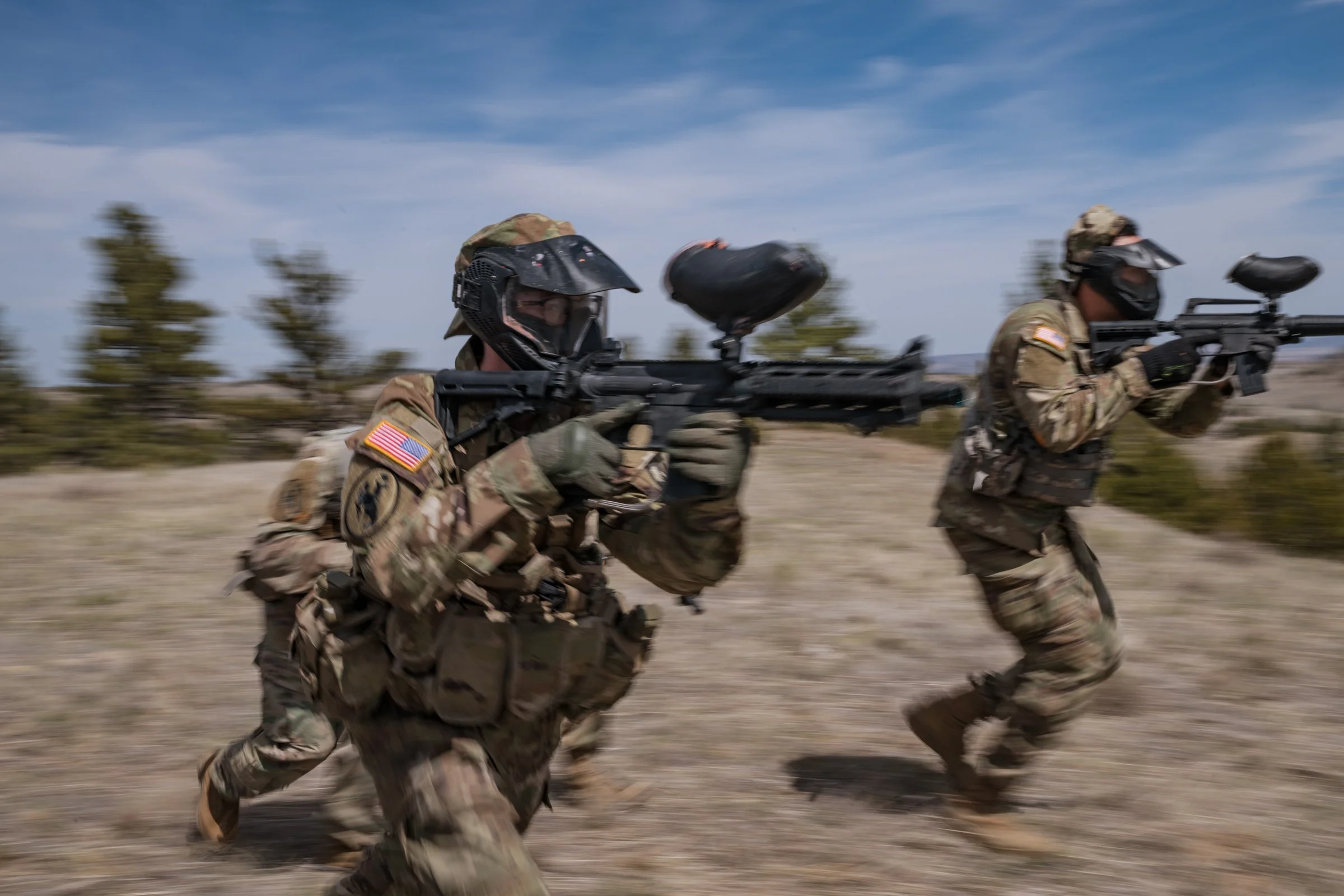 University of Wyoming Army ROTC cadets in full tactical gear advancing during mission exercise at Camp Guernsey April 2025