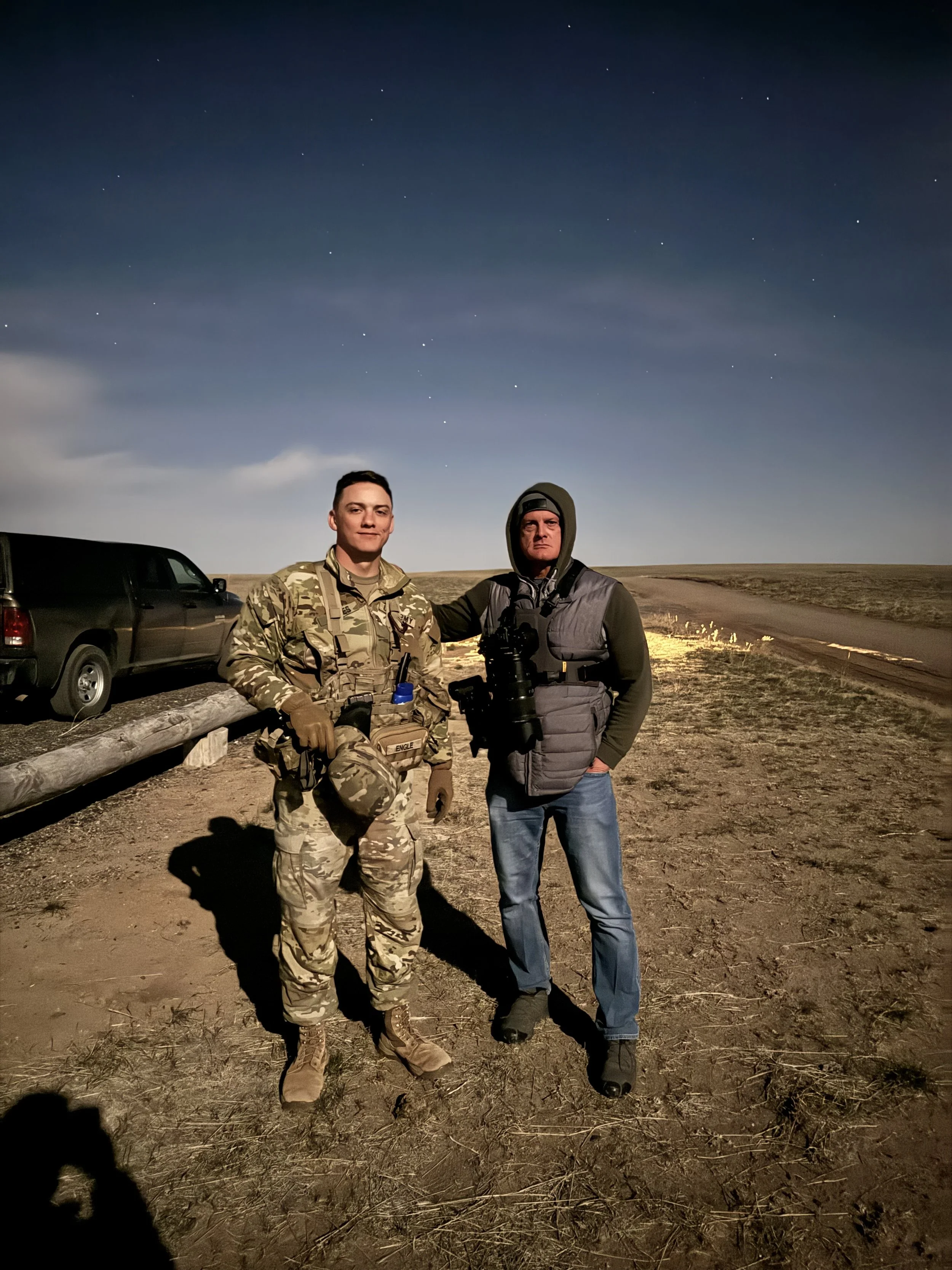 Photographer Tim Engle and son Ryan Engle University of Wyoming Army ROTC cadet together at Camp Guernsey field training exercise April 2025