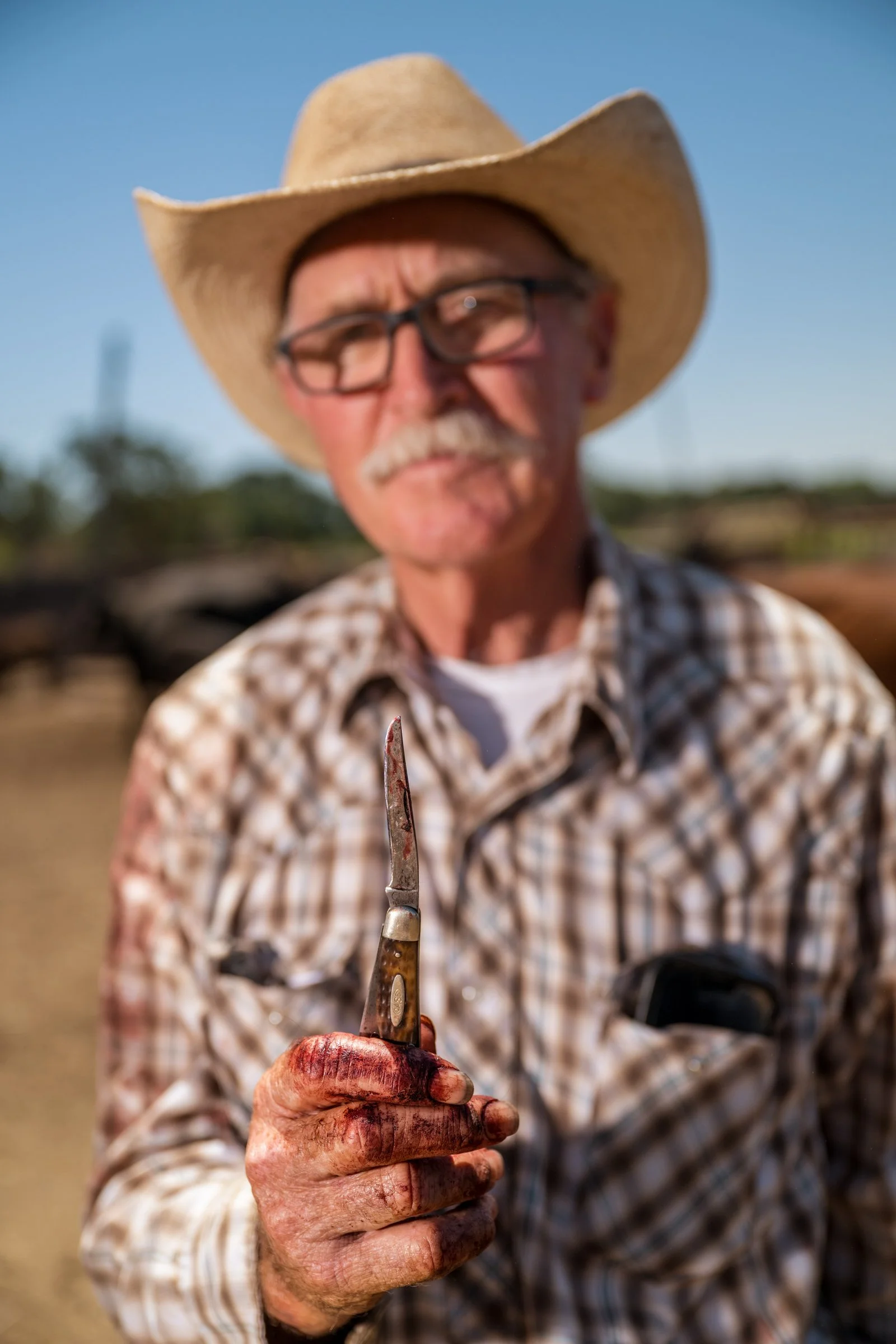 Tom Mayan holding his historic riverbank knife used for decades of cattle roundups at Mahon Ranch Sacramento County July 2025