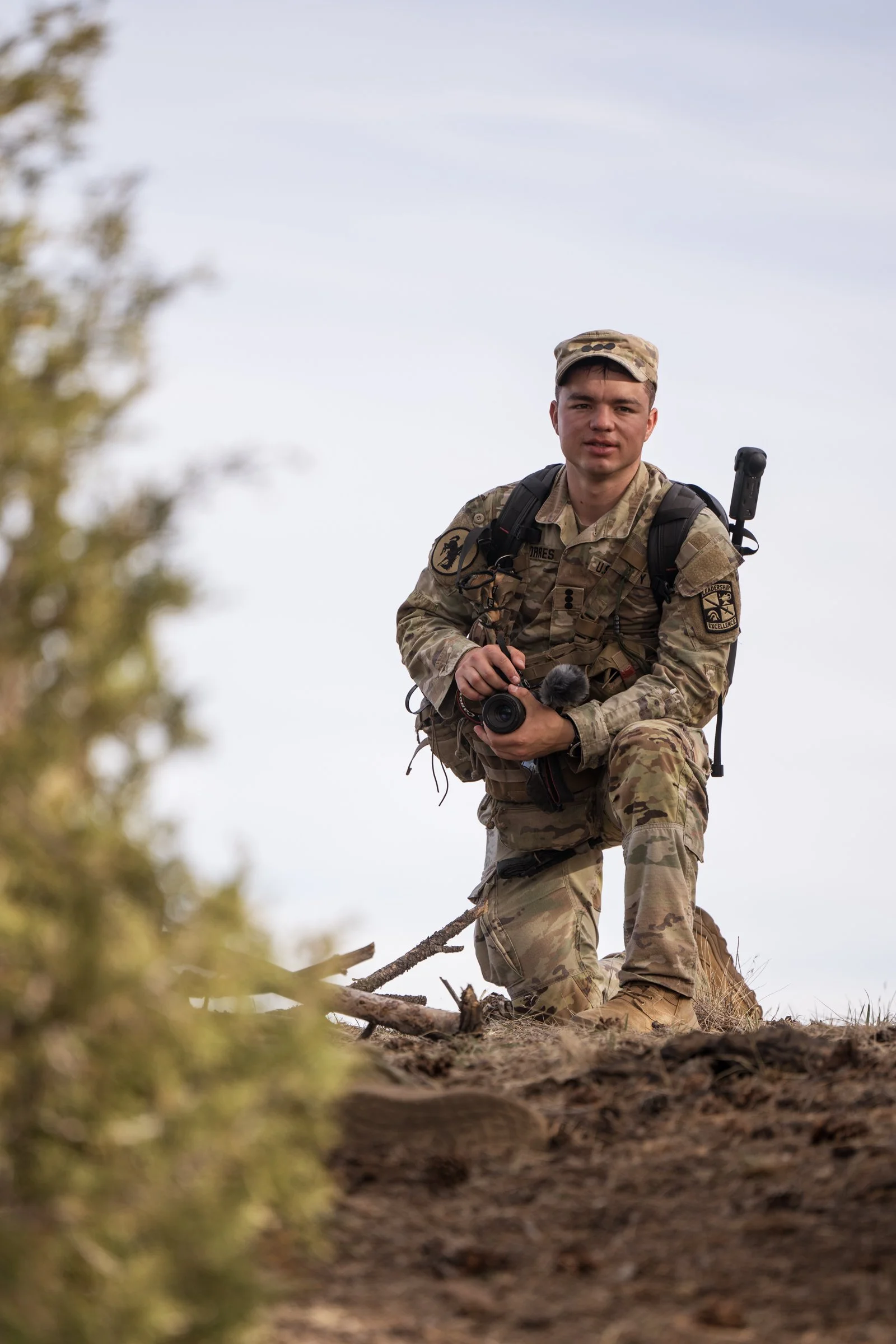 University of Wyoming Army ROTC battalion Public Affairs Officer cadet Louis with camera at Camp Guernsey field training exercise April 2025