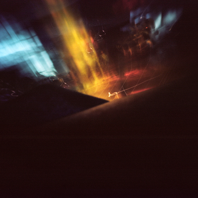 A pinhole from the Sagrada Familia . The area inside and out was swarming with tourists so you can imagine what happened the first time I put my pinhole camera on the floor. A tourist came by with his hands raised taking pictures of the ceiling and kicked the camera. I immediately picked it up and wound to a new frame. This image was not intentional but I love the result.