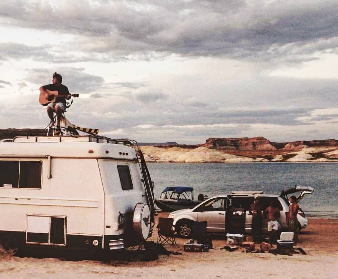 Samuel Davey perched on the bus, Lake Powell, USA.