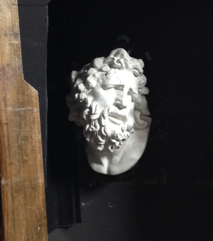 Laocoön in his shadow box home.