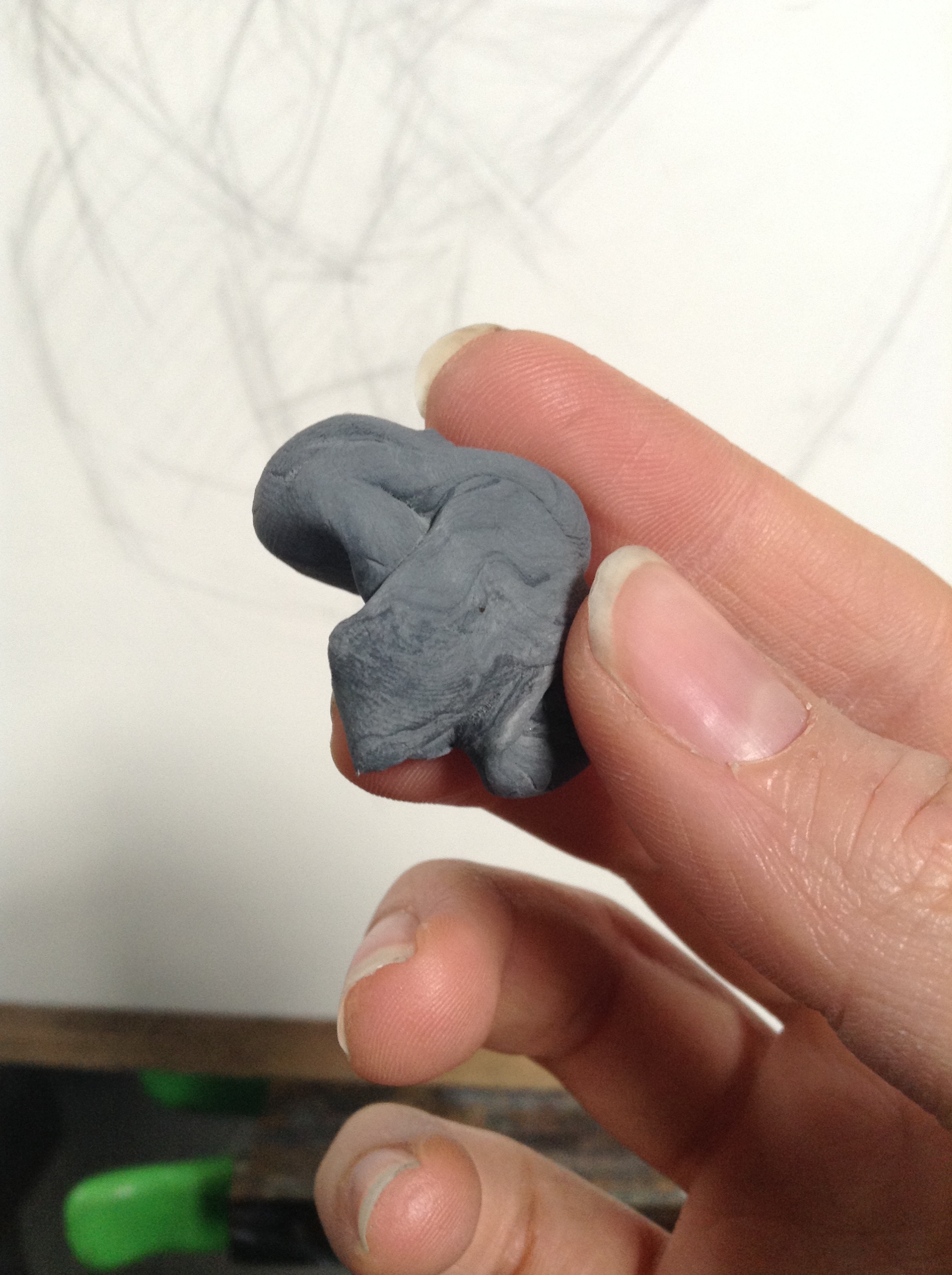  This is a kneaded eraser--moldable and stretchy. Watch what happens next! 